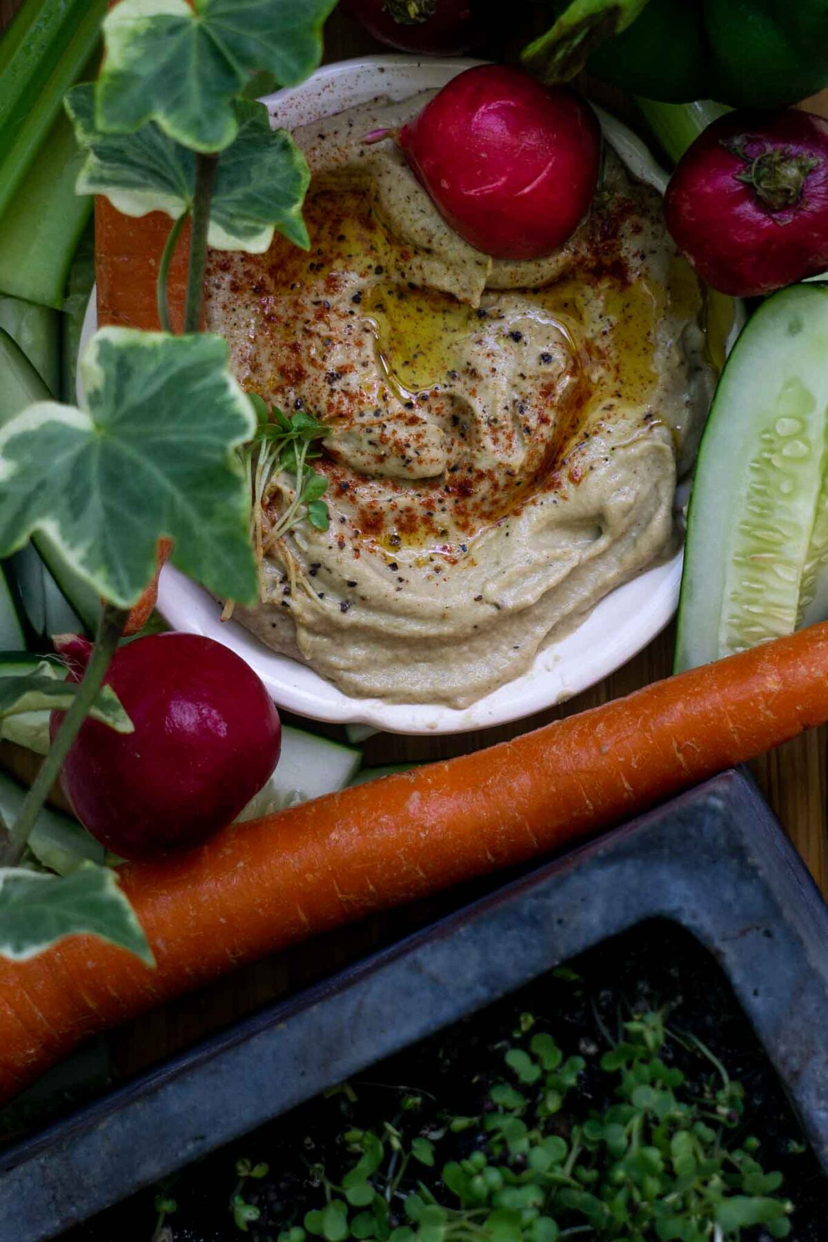 Baba ghanoush surrounded by vegetables