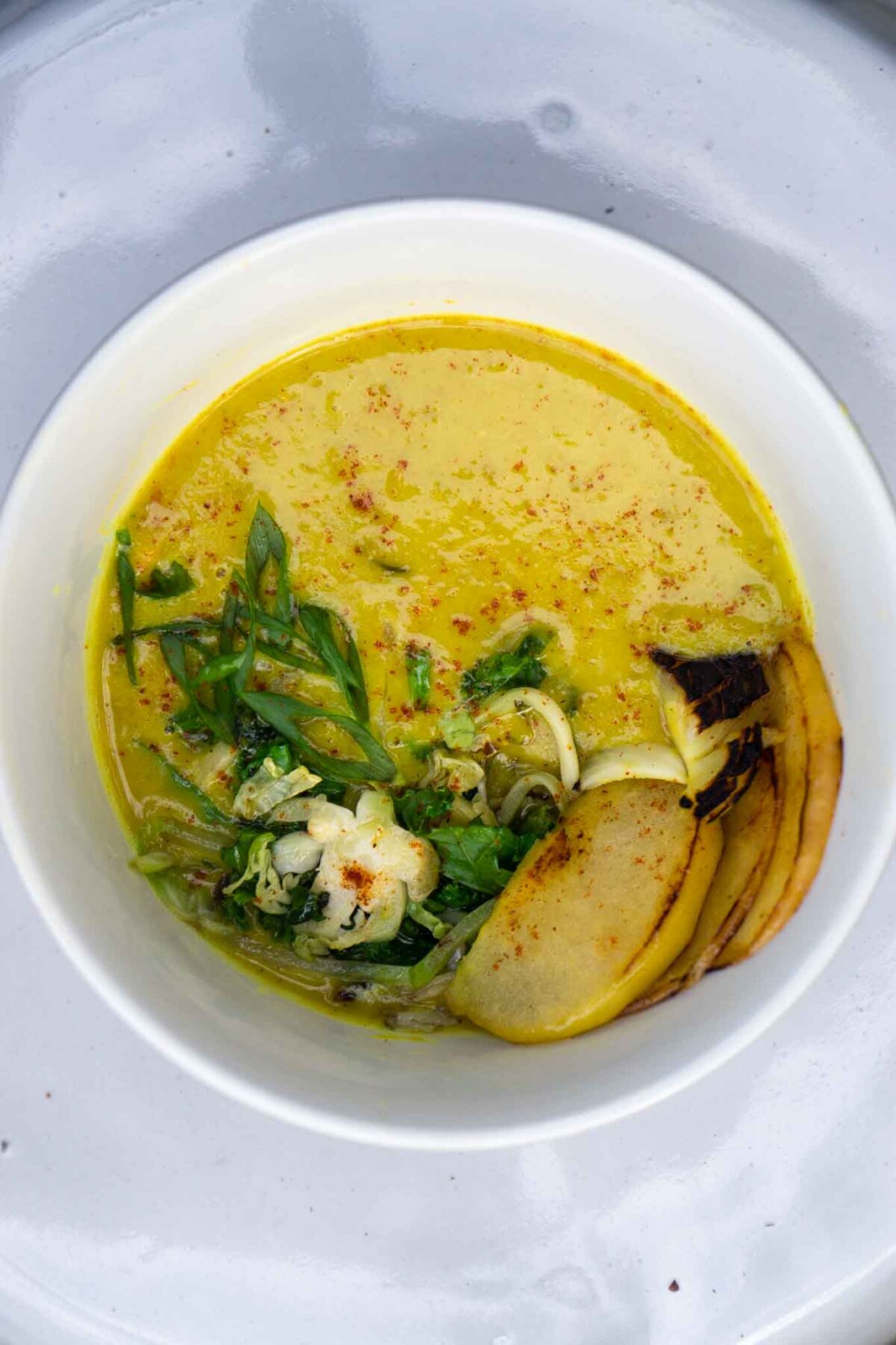 turmeric split pea soup in white bowl