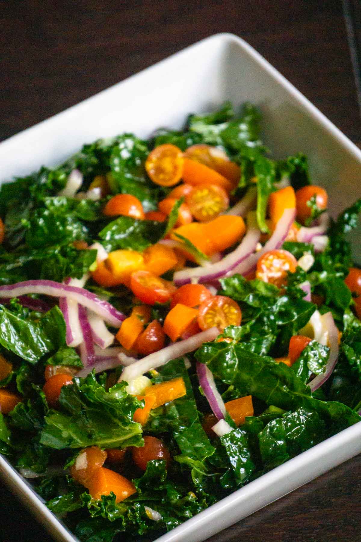 kale salad with tomatoes, onions, and peppers