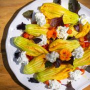 squash blossoms topped with purple basil and ricotta