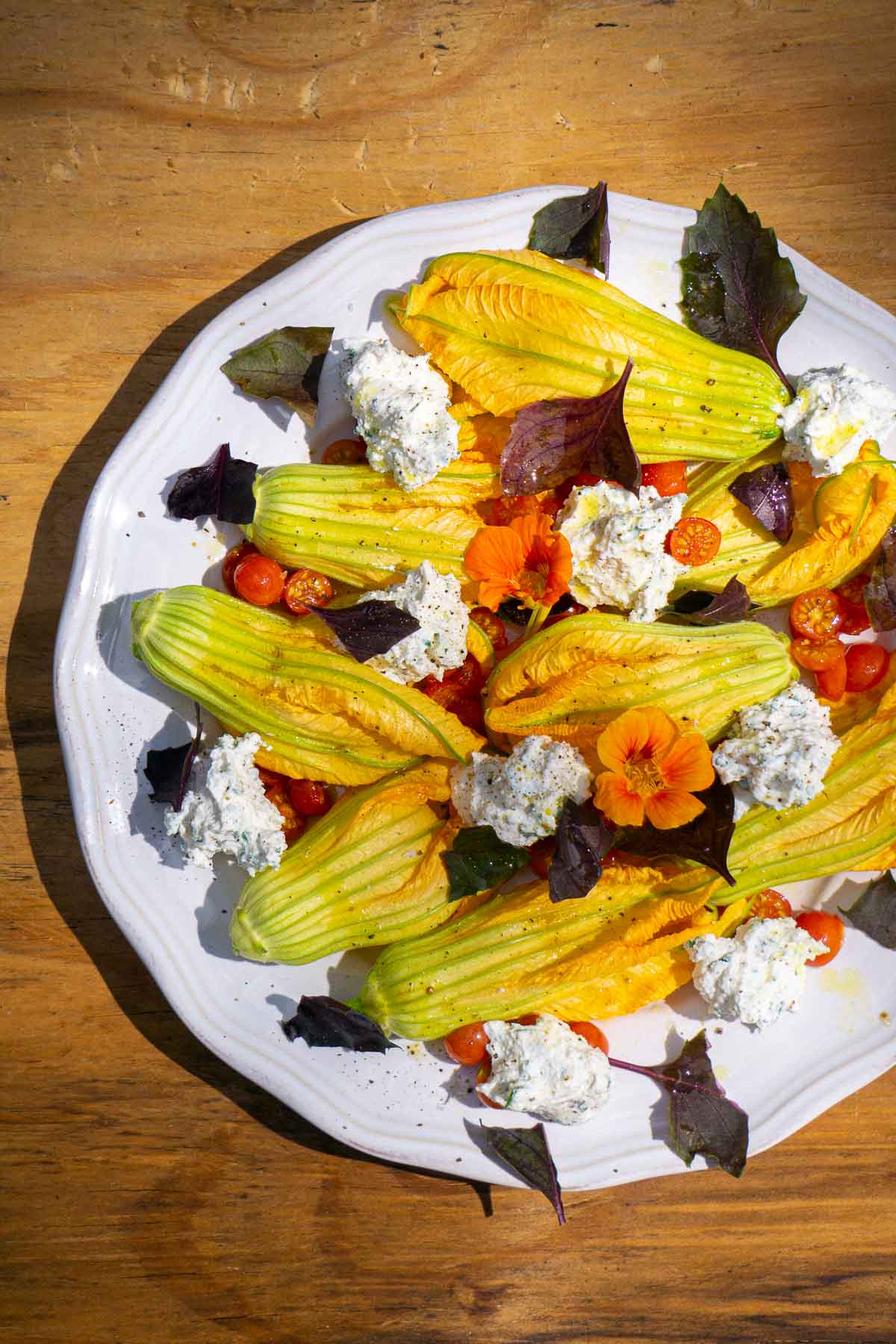 squash blossoms topped with purple basil and ricotta
