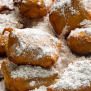 beignets covered in powdered sugar close up