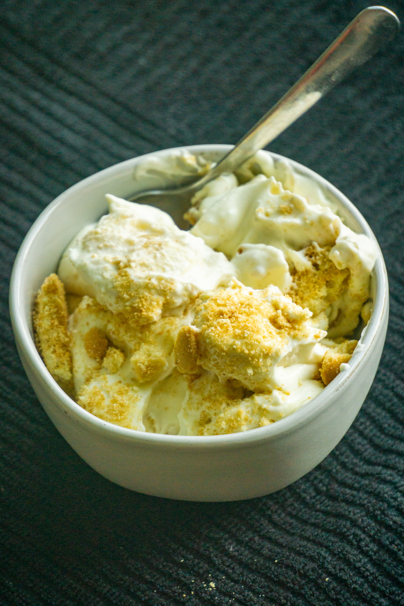 rich, creamy banana pudding in a white dessert bowl.